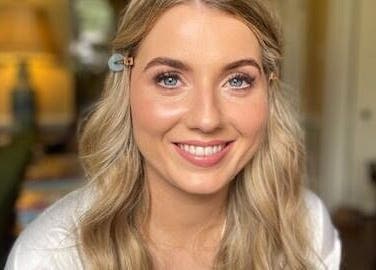 Smiling woman with makeup by Kellie Fitzgibbon Makeup & Lash Artist in Stepaside, County Dublin, IE.