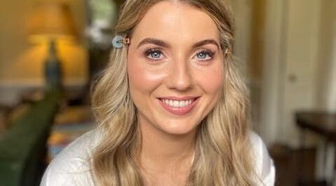 Smiling woman with makeup by Kellie Fitzgibbon Makeup & Lash Artist in Stepaside, County Dublin, IE.