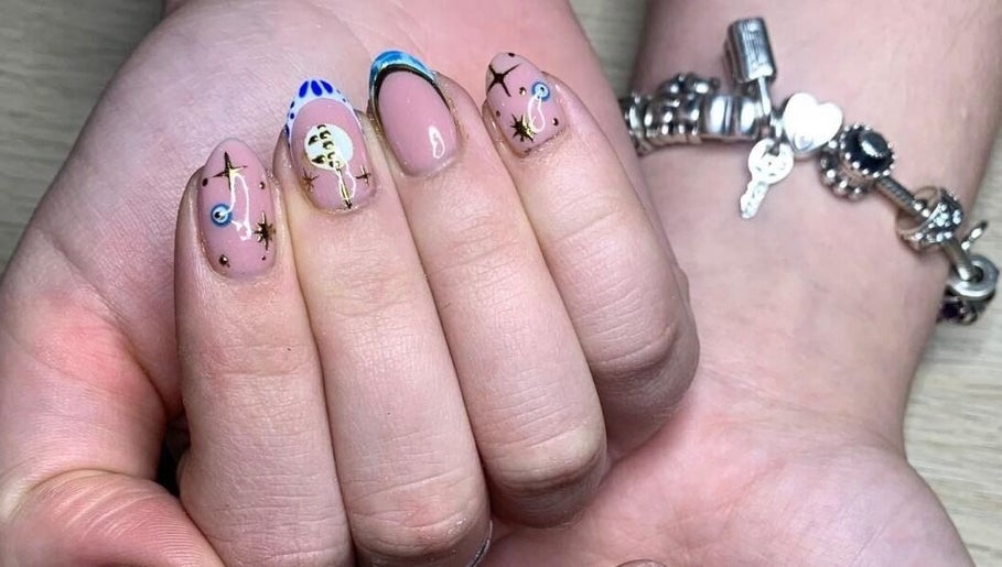 Artistic celestial nail design at The Nailwork Lounge, Mid Calder, Scotland, GB. Unique nail art showcase.