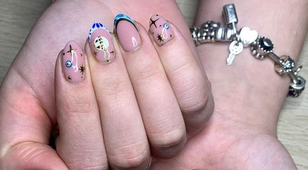Artistic celestial nail design at The Nailwork Lounge, Mid Calder, Scotland, GB. Unique nail art showcase.