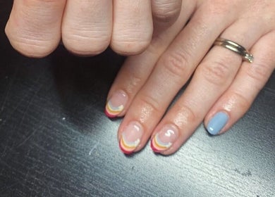 Colorful nail art design at The Nailwork Lounge in Mid Calder, Scotland, GB showcasing creative manicure.