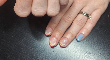 Colorful nail art design at The Nailwork Lounge in Mid Calder, Scotland, GB showcasing creative manicure.