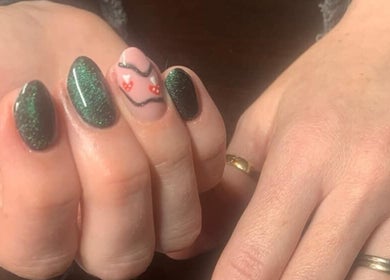 Stylish nail art at The Nailwork Lounge, Mid Calder, Scotland, GB, featuring green and pink designs.