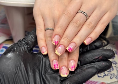 Floral nail art design at Painted Nails and Beauty, Dunbar, Scotland, GB. Delicate pink and yellow manicure.