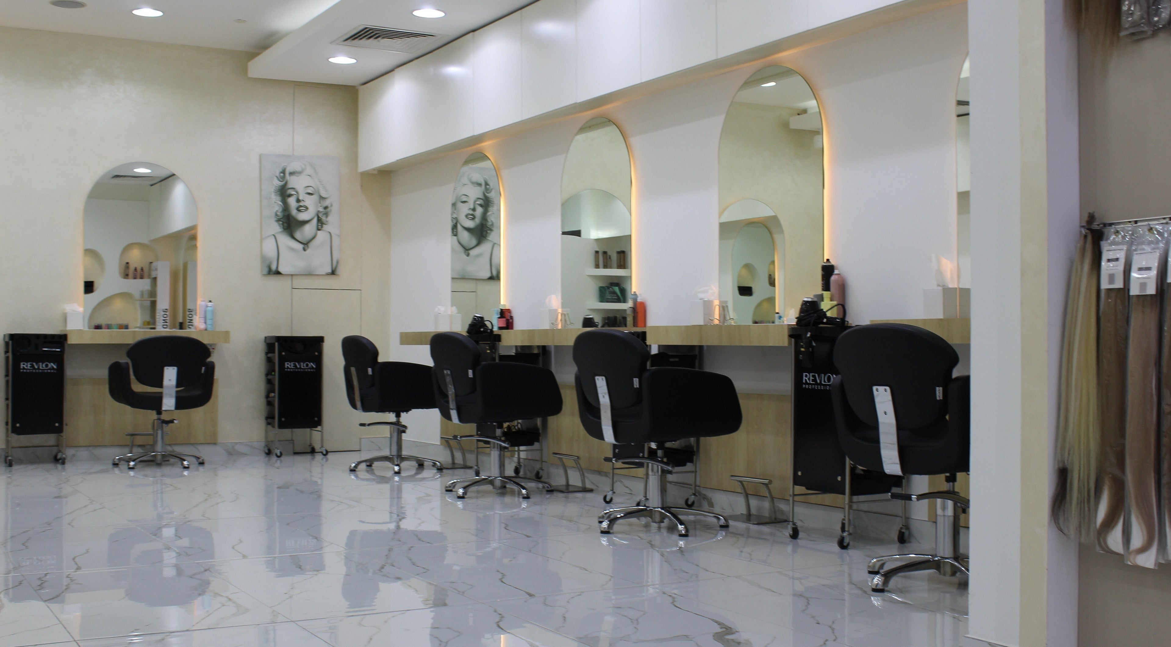 Modern salon interior at Kals Ladies Salon, Dubai, Dubai, AE, featuring stylish chairs and mirrors.