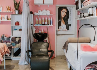 Chic and cozy salon setup at Inge Myburgh Studio, Cape Town, Western Cape, ZA with plush seating and beauty products.