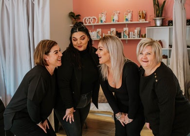 Team at Inge Myburgh Studio, Cape Town, ZA, sharing a joyful moment in the wellness space.