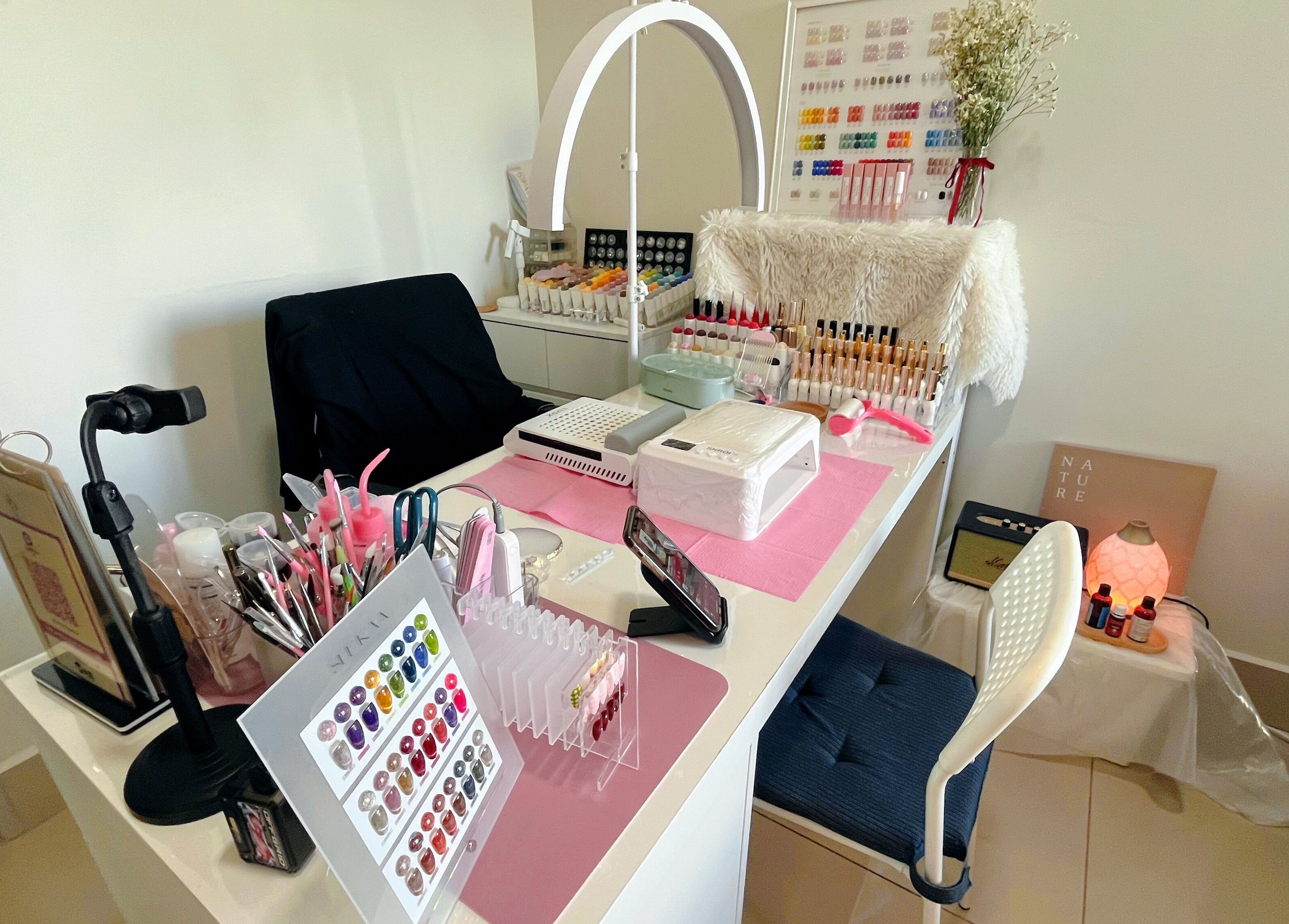 Nail station at Beauty Studio 101, Sungai Besi, Selangor, MY, showcasing colorful nail polish and tools.