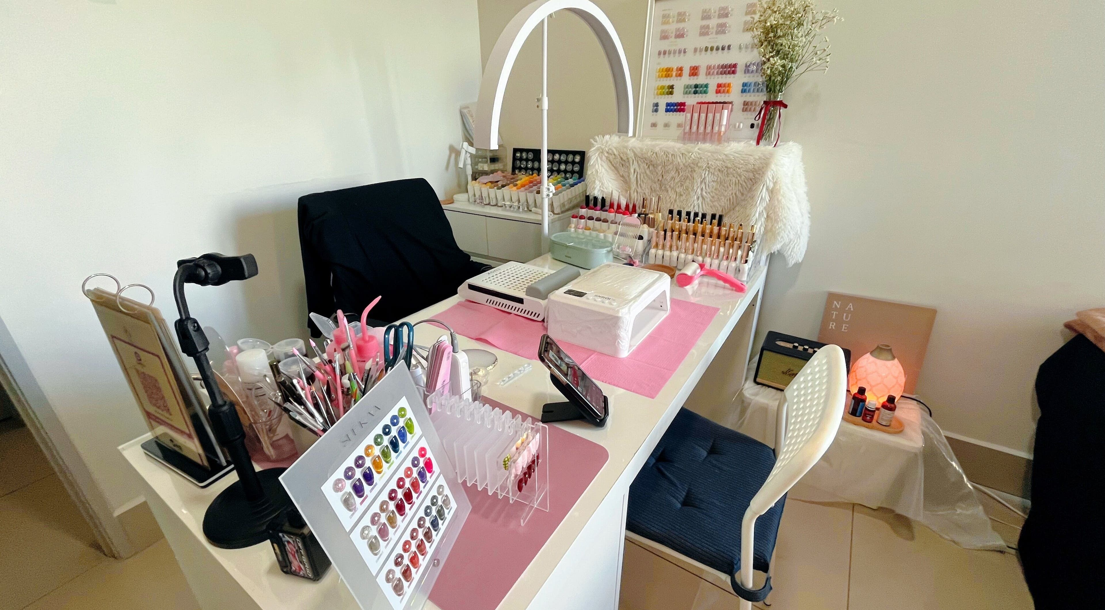 Nail station at Beauty Studio 101, Sungai Besi, Selangor, MY, showcasing colorful nail polish and tools.