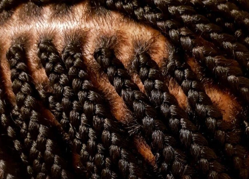 Close-up of intricate braids at AmiCable Braids, Grantham, England, GB, showcasing sleek styling.