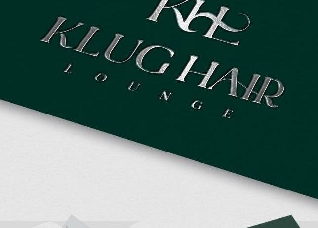 Metallic sign reading 'Klug Hair Lounge' for AmiCable Braids, Grantham, England, GB.