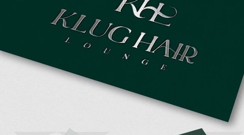 Metallic sign reading 'Klug Hair Lounge' for AmiCable Braids, Grantham, England, GB.