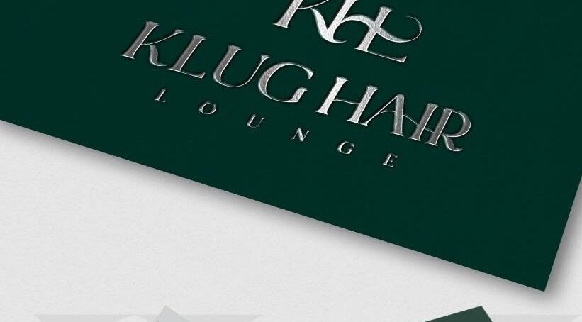 Metallic sign reading 'Klug Hair Lounge' for AmiCable Braids, Grantham, England, GB.