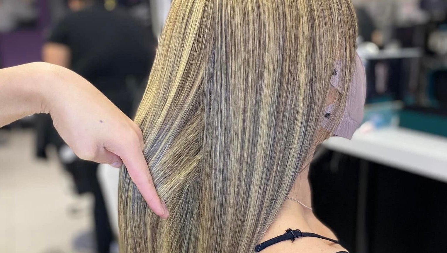 Blonde highlights at Hyper Cut Salon, Cape Town, Western Cape, ZA. Smooth and styled hair.