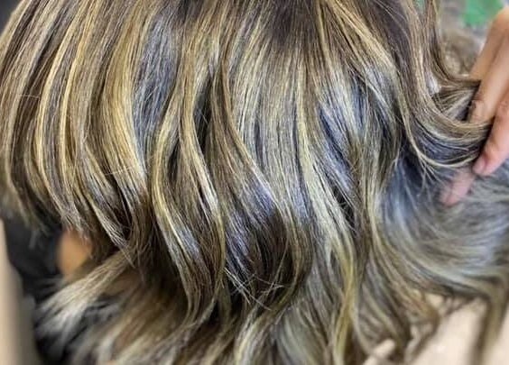 Styled blonde highlights at Hyper Cut Salon in Cape Town, Western Cape, ZA showcasing expert hairstyling.