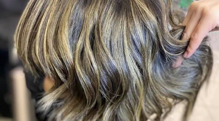 Styled blonde highlights at Hyper Cut Salon in Cape Town, Western Cape, ZA showcasing expert hairstyling.