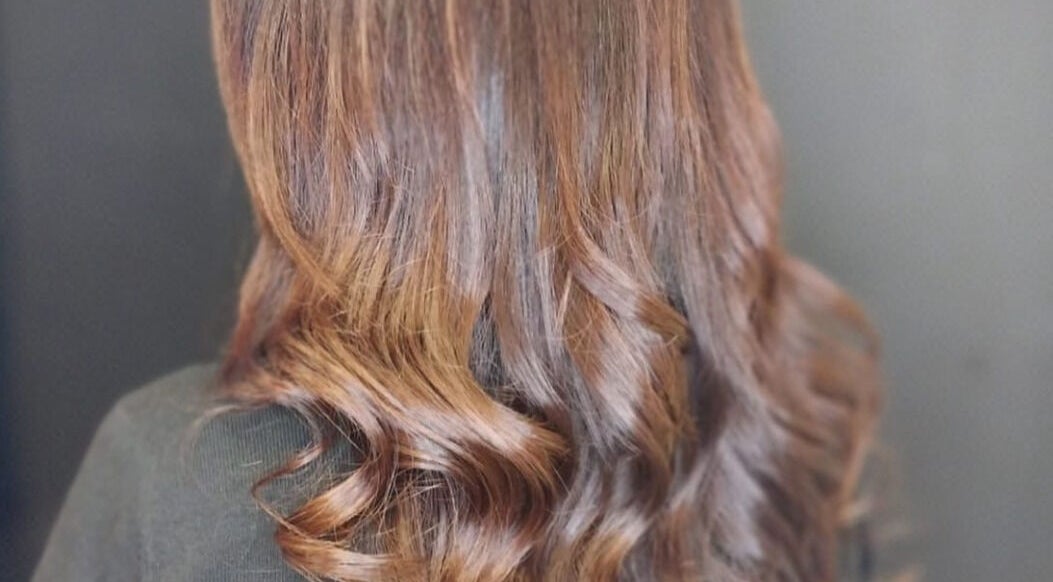 Elegant wavy hairstyle at Hyper Cut Salon in Cape Town, Western Cape, ZA.