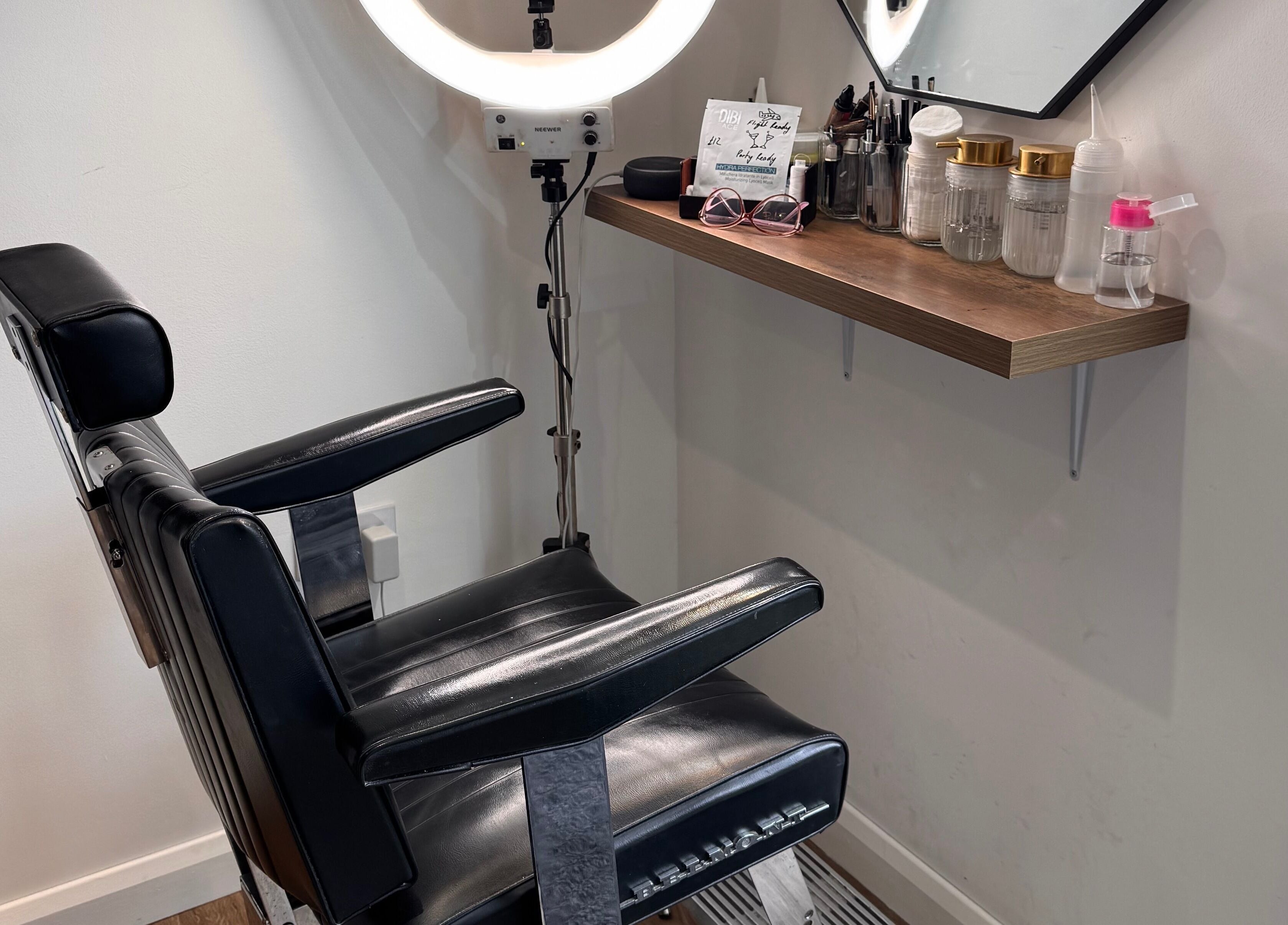 Stylish salon chair and beauty tools setup at Retreat in Stockport, England, GB.