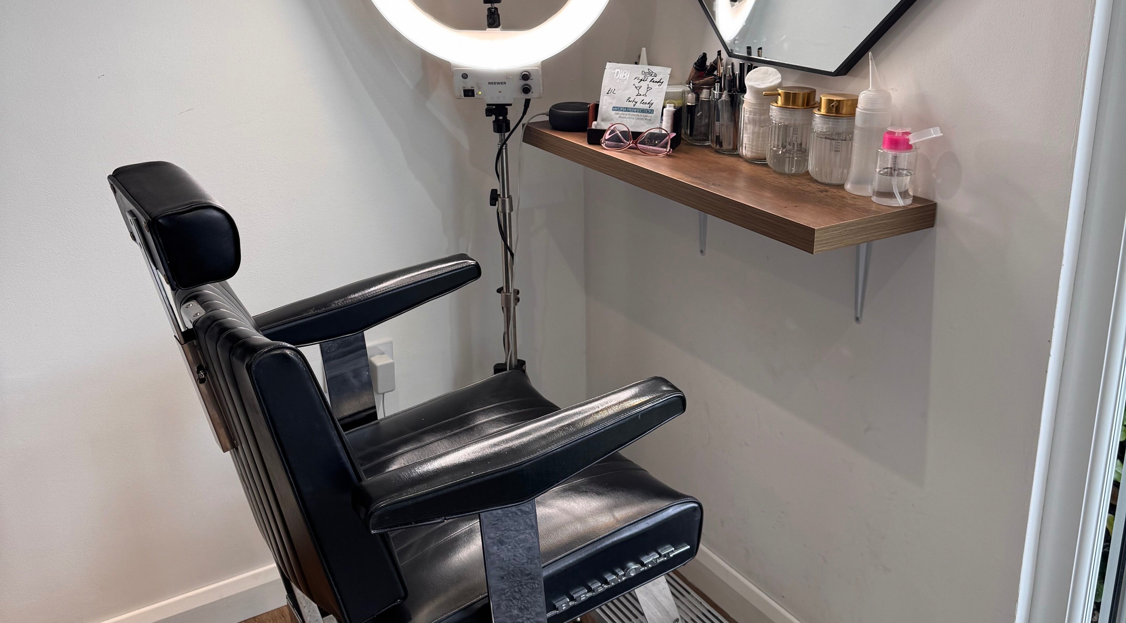 Stylish salon chair and beauty tools setup at Retreat in Stockport, England, GB.