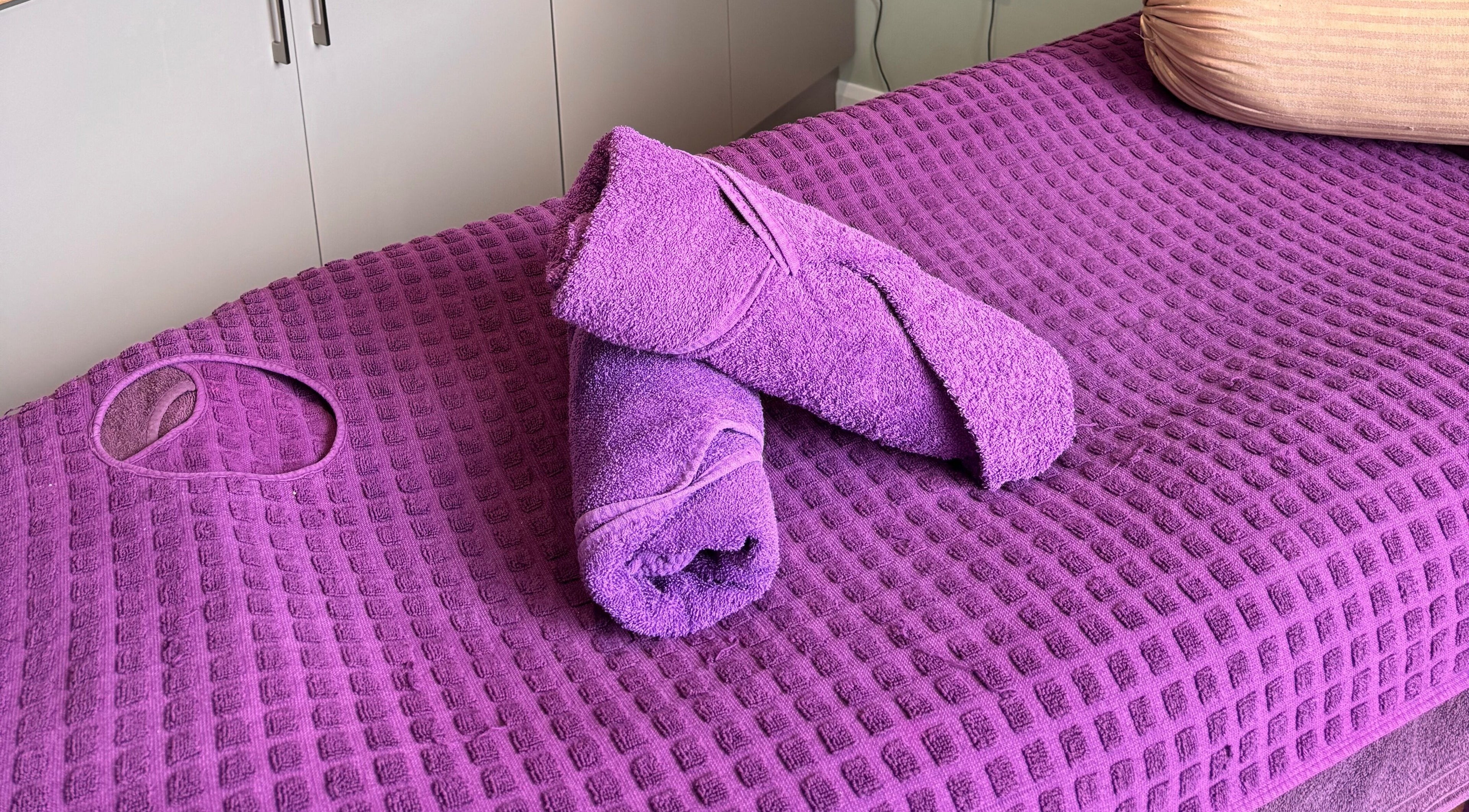 Plush purple massage towels at Retreat, Stockport, England, GB.