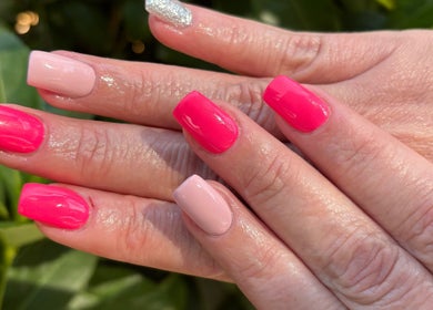 Bright pink and nude manicure from The Spoil Spot, Benoni, Gauteng, ZA, showcasing stunning nail art.