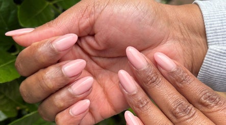 Elegant pink manicure at The Spoil Spot, Benoni, Gauteng, ZA, showcasing well-groomed hands.