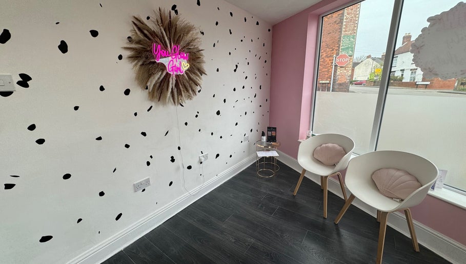 Stylish waiting area at Glow Beauty and Aesthetics, Newhall, England, GB with modern decor and seating.