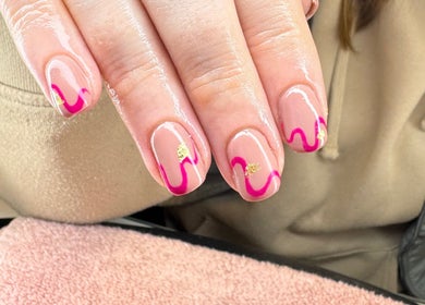 Beautiful pink and gold nail art at Glow Beauty and Aesthetics, Newhall, England, GB.