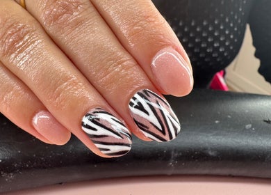 Stylish zebra nail art at Glow Beauty and Aesthetics, Newhall, England, GB showcasing elegant designs.