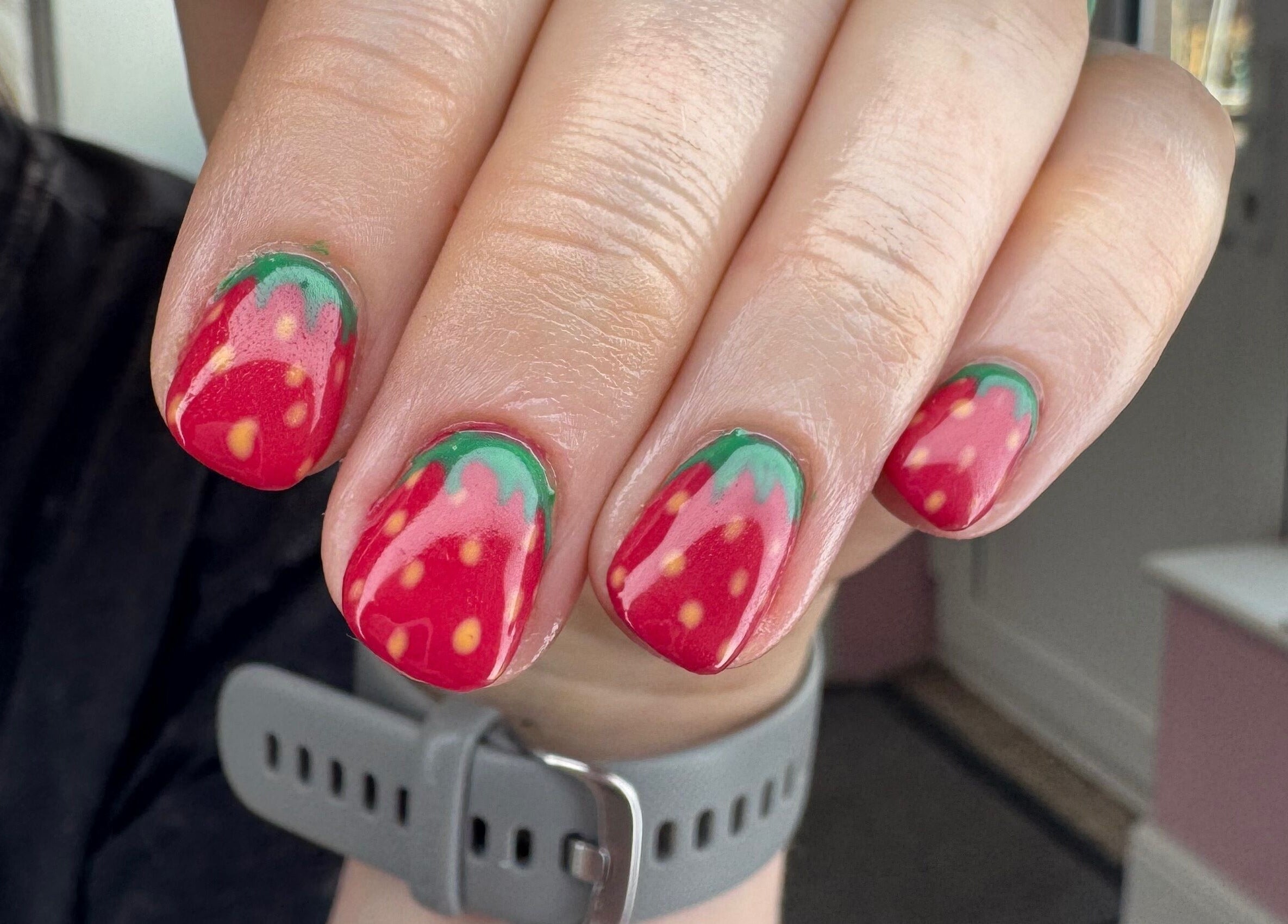 Strawberry nail art at Glow Beauty and Aesthetics, Newhall, England, GB. Bold and creative design.