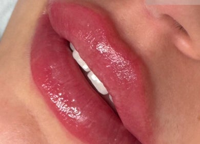Close-up of glossy lips at JM Cosmetics & Skin Clinic, Penarth, Wales, GB, enhancing natural beauty.