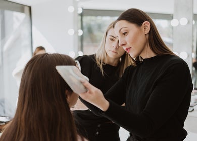 Makeup artist at Studio Luxe Collective in Bloemfontein, Free State, ZA, enhancing client's beauty.