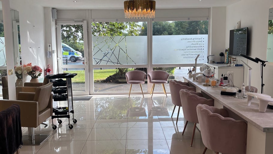 Interior of LUMA Laser and Beauty in Salford, England, featuring elegant seating and bright natural light.