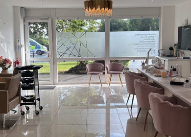 Interior of LUMA Laser and Beauty in Salford, England, featuring elegant seating and bright natural light.