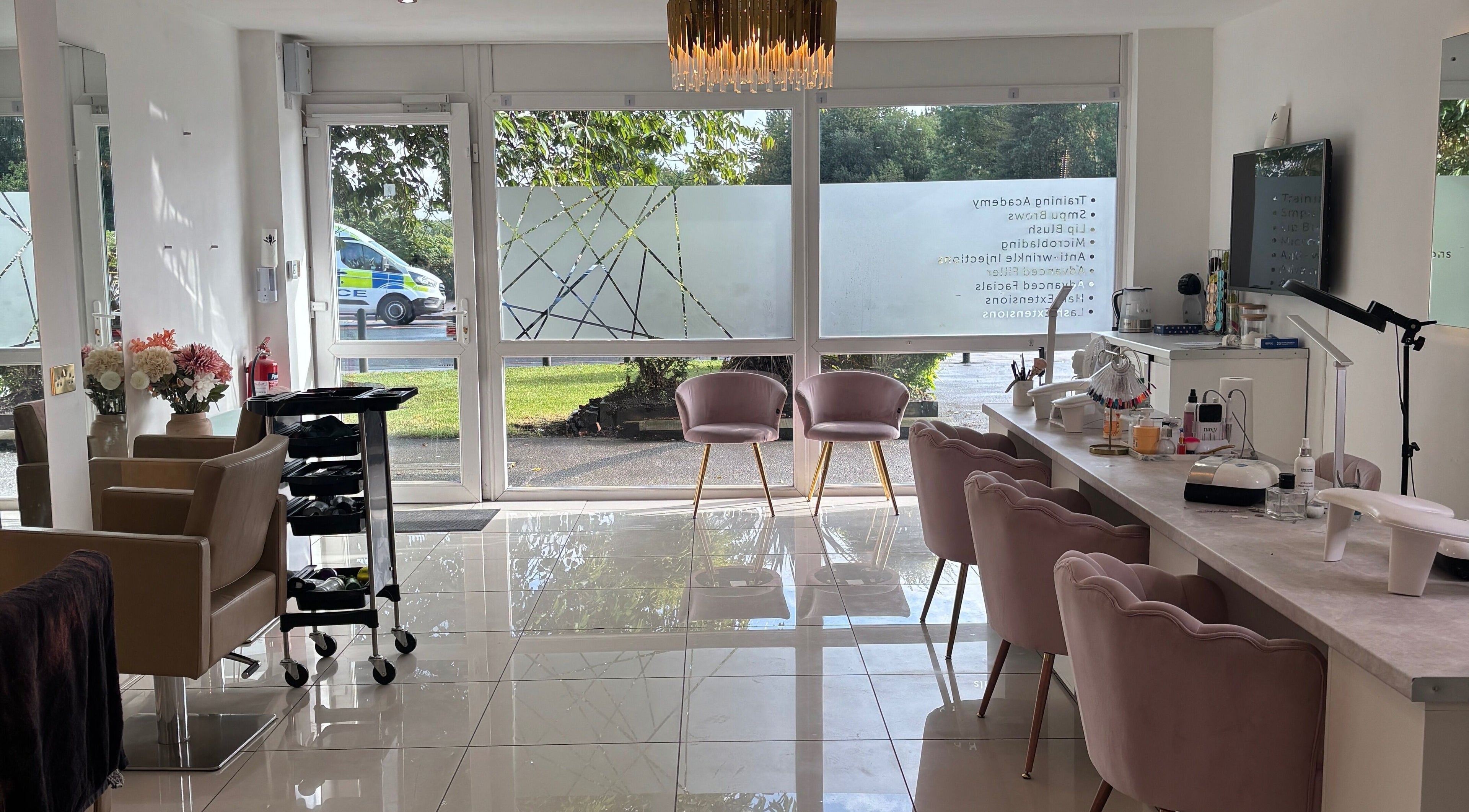 Interior of LUMA Laser and Beauty in Salford, England, featuring elegant seating and bright natural light.