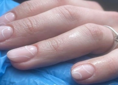 Hand with elegant nail art and a silver ring at LUMA Laser and Beauty, Salford, England, GB.