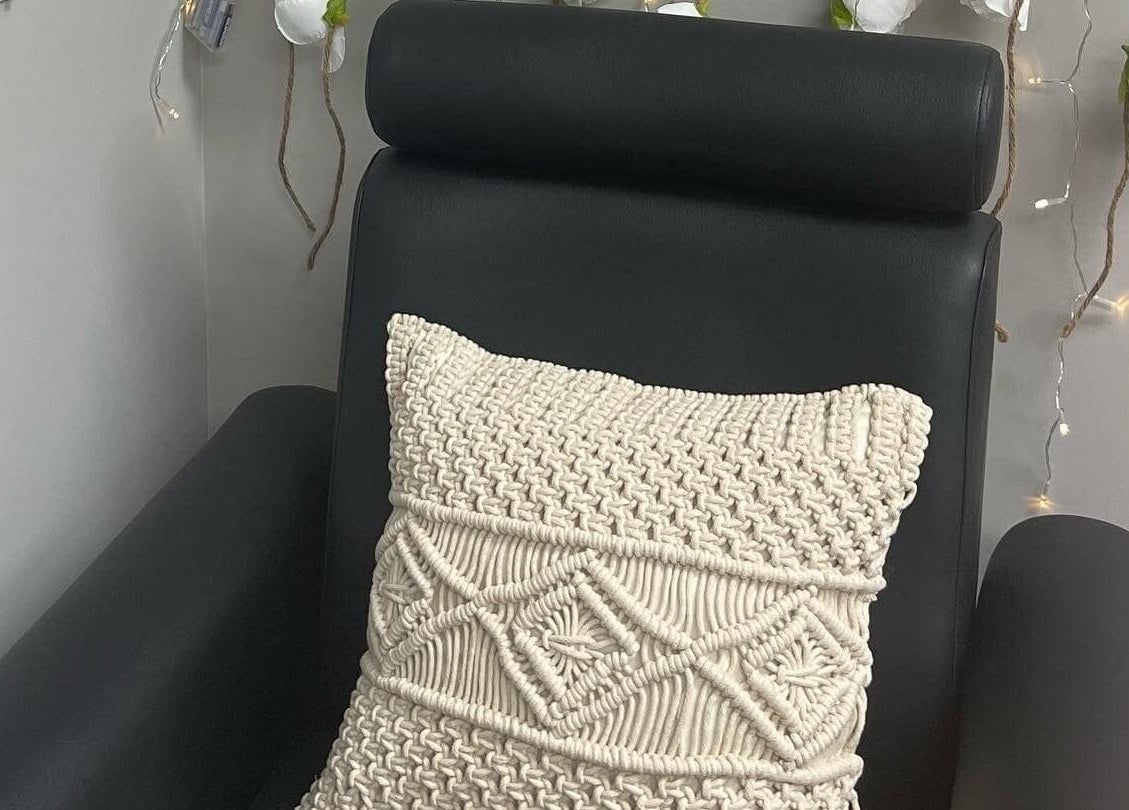 Comfortable chair with knitted cushion at Nails by Kzerbs, Willoughby Hills, Ohio, US.