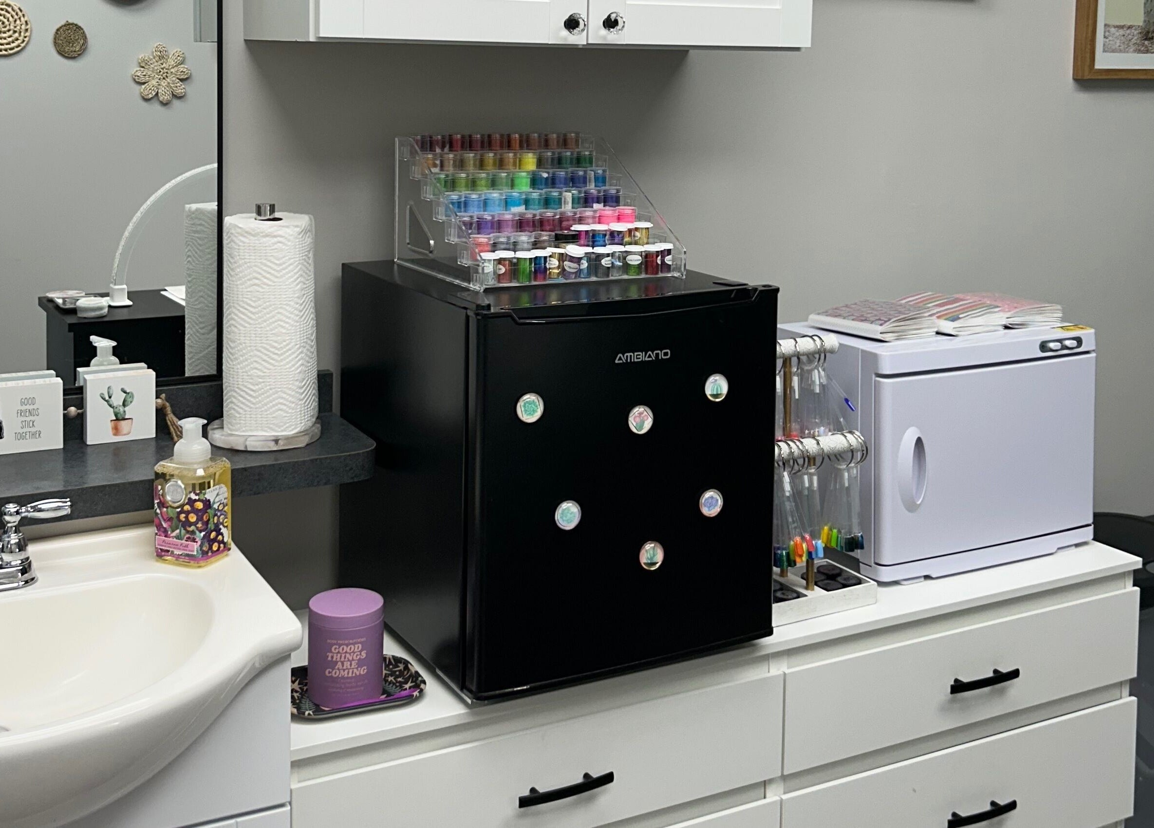 Nail polish display and sink at Nails by Kzerbs, Willoughby Hills, Ohio, US. Modern and organized salon workspace.