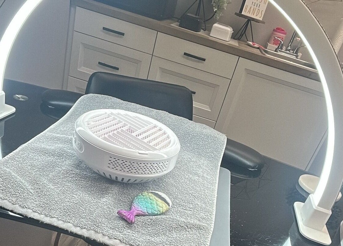 Modern nail station at Nails by Kzerbs, Willoughby Hills, Ohio, US, showcasing a sleek setup with bright lighting.