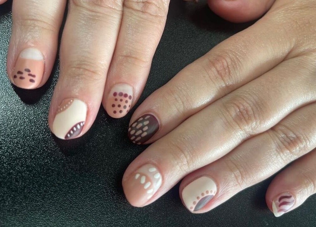 Elegant dotted nail art design from Nails by Kzerbs in Willoughby Hills, Ohio, US.