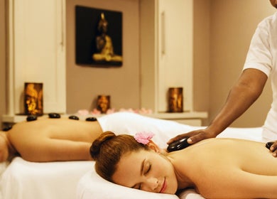 Relaxing hot stone massage at Karma Spa - Sugar Bay Barbados, in Christ Church, BB, offering luxurious wellness treatments.