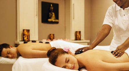 Relaxing hot stone massage at Karma Spa - Sugar Bay Barbados, in Christ Church, BB, offering luxurious wellness treatments.