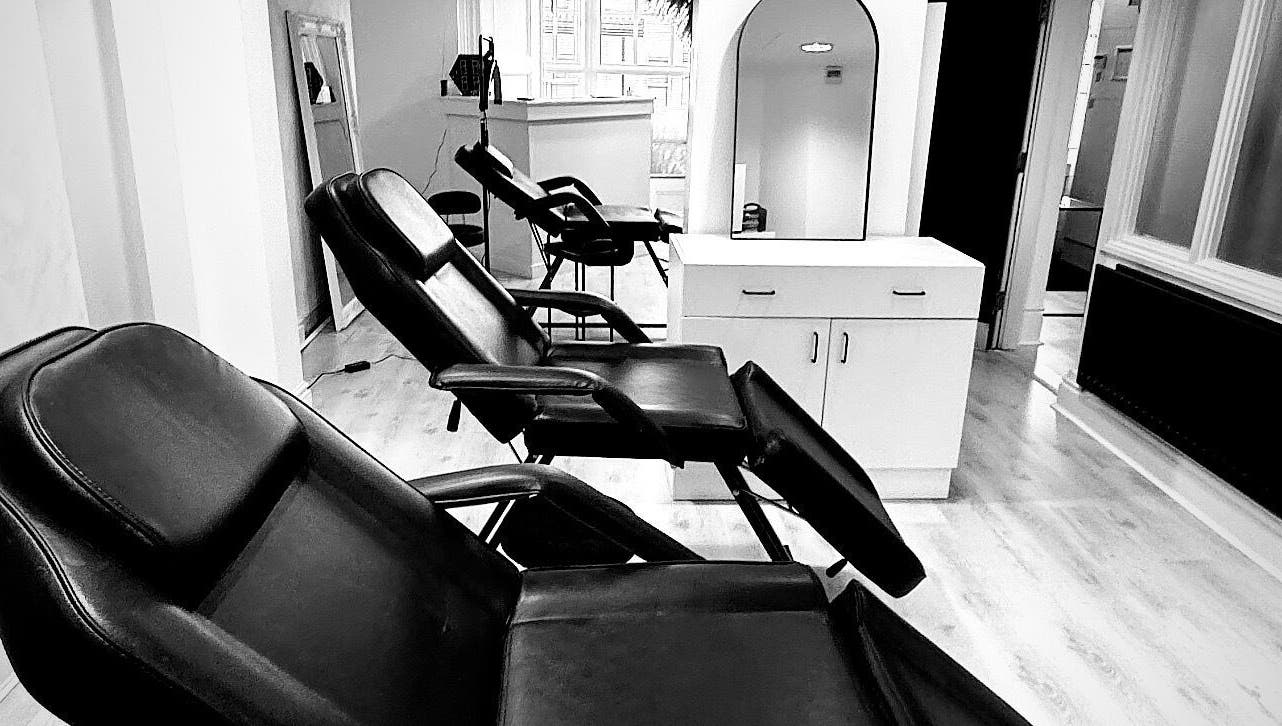 Modern black chairs at NS Aesthetics & Beauty, Shildon, England, GB. Ideal for relaxation and beauty treatments.