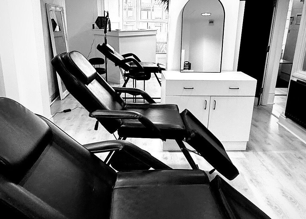 Modern black chairs at NS Aesthetics & Beauty, Shildon, England, GB. Ideal for relaxation and beauty treatments.