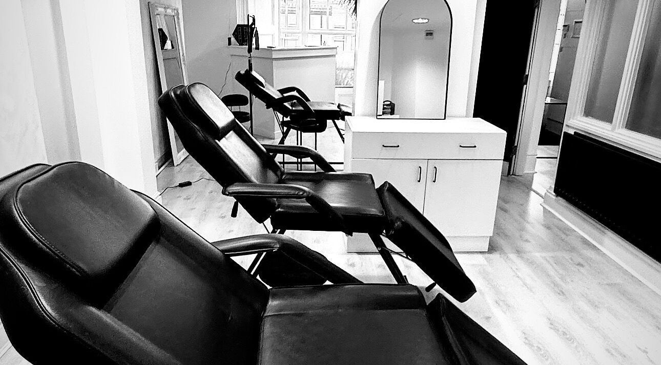 Modern black chairs at NS Aesthetics & Beauty, Shildon, England, GB. Ideal for relaxation and beauty treatments.