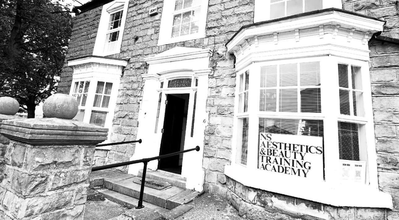 Exterior view of NS Aesthetics & Beauty in Shildon, England, GB showing a welcoming stone entrance.