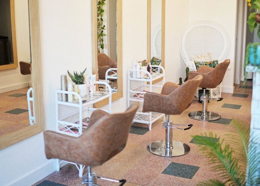 Elegant salon interior at Boho Bombshell, White Gum Valley, Western Australia, AU with stylish mirrors and chairs.