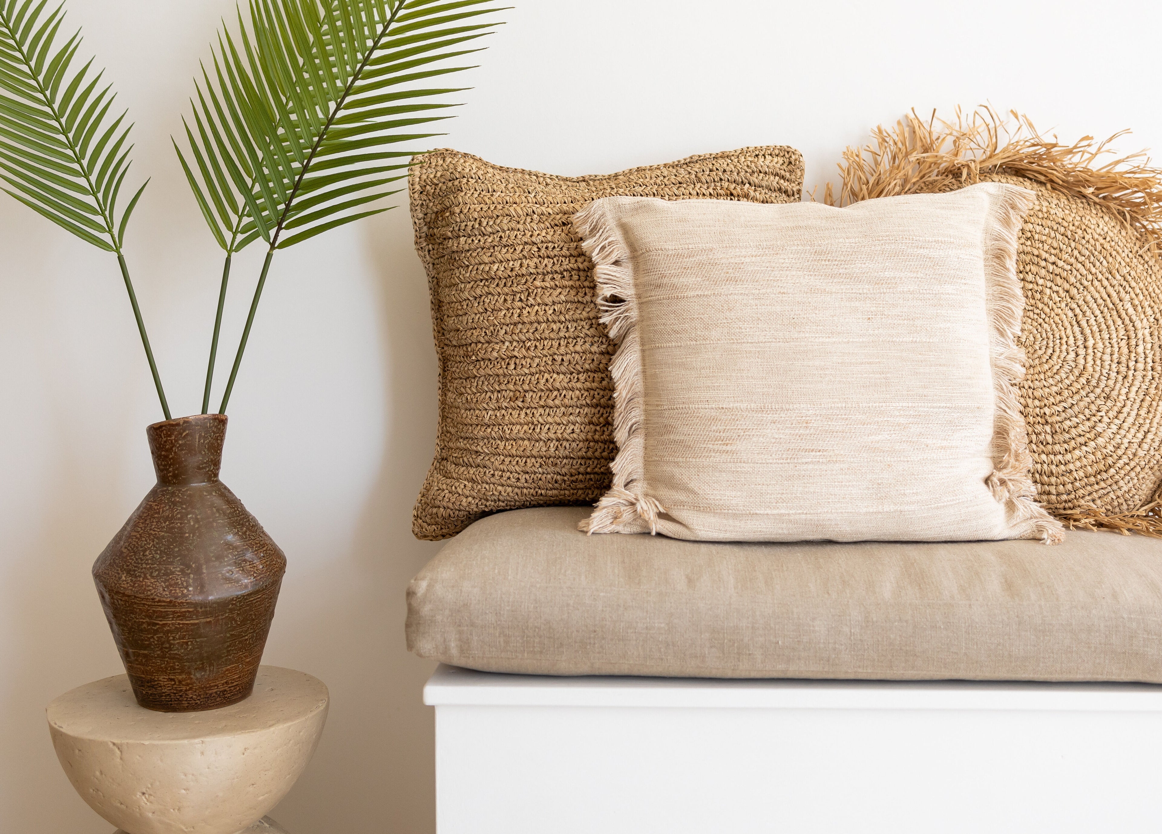Cozy seating area at Be. Laser and Skin Clinic in Taunton, England, GB with stylish cushions and a leafy plant.