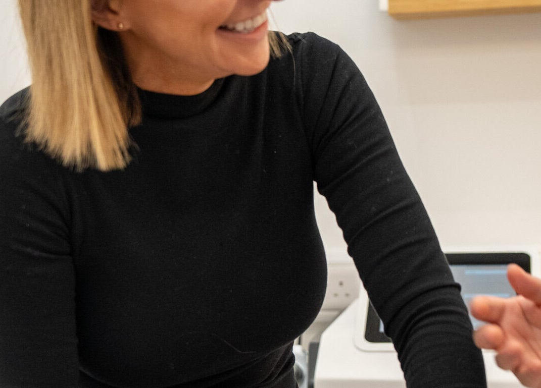 Smiling beautician at Be. Laser and Skin Clinic, Taunton, England, GB offering a warm welcome.