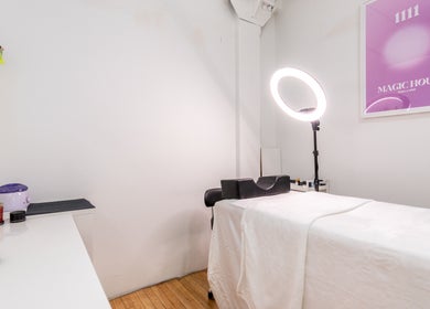 Tranquil treatment room at PALM, Montréal, Québec, CA, featuring a massage table and ambient lighting.